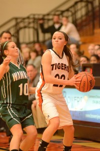 Eryn Leek of Warsaw looks for a teammate as Wawasee's Liz Jackson defends her Saturday night in Warsaw.