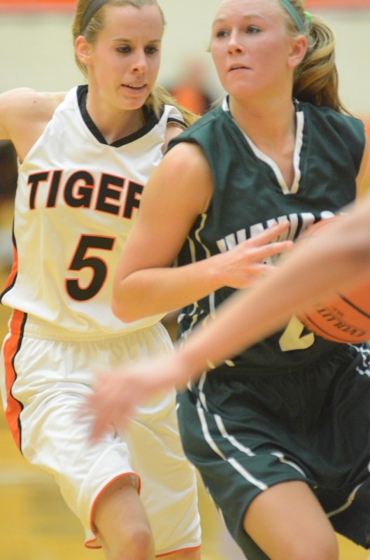 Warsaw's Sarah Ray guards  KiLee Knafel of Wawasee during a recent NLC contest. Both players will be in action over the holiday break as Warsaw hosts its own tourney Dec. 27 and Wawasee plays in the Norwell Shootout Dec. 29