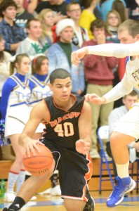 Rashaan Jackson of Warsaw keeps his balance on a drive to the basket versus Triton Tuesday night.