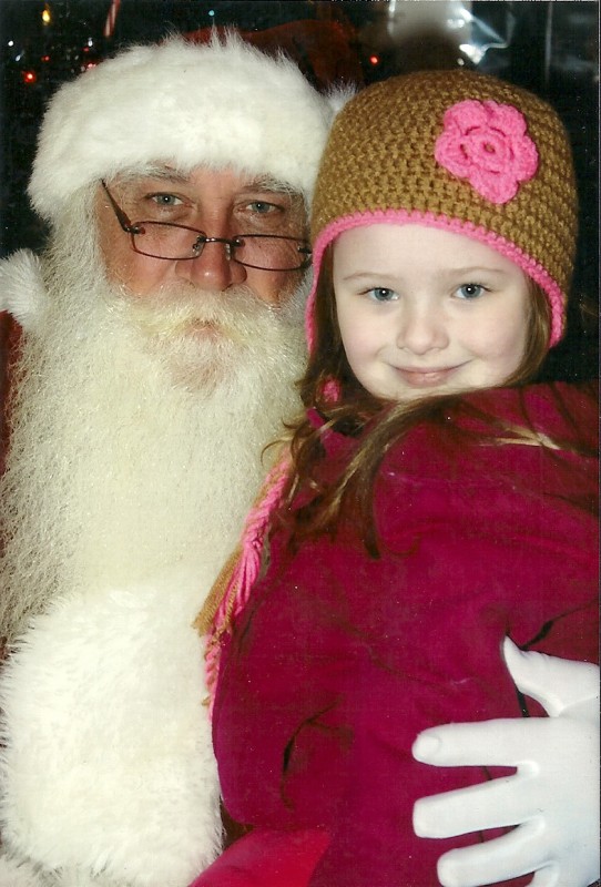 Kendra Lynn Ousley, age 4, with Santa Claus.