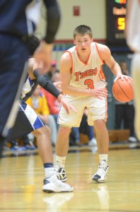 Jared Bloom looks for room in sectional play in Elkhart Tuesday night. The star senior scored a game-high 17 points and hit the game winning free throw in a 45-44 win in double overtime over Elkhart Central.