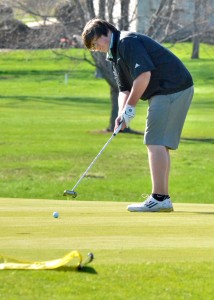 Tristen Atwood of Wawasee stares down his putt on hole four at South Shore Monday night against Fairfield, Elkhart Central and West Noble. (Photos by Nick Goralczyk)