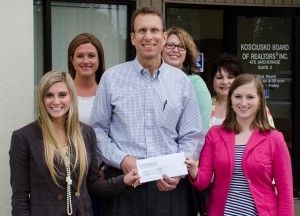 KBOR® scholarship winners are recognized. In front, from left, are scholarship winner Jenna Coy; KBOR President Steve Savage of ReMax Rainbow REALTORS®, and Miranda Moss. In back are members of our scholarship committee: Amanda Tom of Mutual Bank, Lori Bolyard of Beacon Credit Union and Marcia Anderson of Conley Realty.