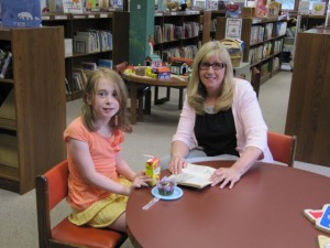  Allison Clark is talking about the book she read with Syracuse children’s librarian, Gisela Vore.  (photo provided)