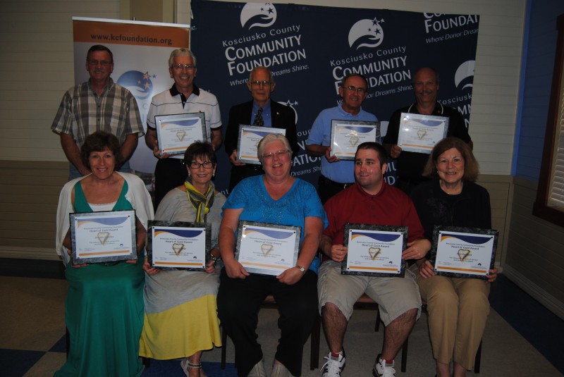 Ten people received a Heart of Gold award Tuesday night in Warsaw. Pictured, in front, from left, are Deb Smalley (for Brooke Smalley), Carole Delp, Karen Hill, Jay Clark, and Patty Donkers (for Ron Donkers). In back are Gary Smalley (for Brooke Smalley), Ot Schroeder, Charles Haffner, Bob Harkness and Terry Wentz. (Photo by Phoebe Muthart) 