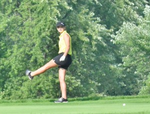 Elizabeth Jackson shows some frustration with a putt on number seven. The Lady Warrior junior led her team with a 45. 