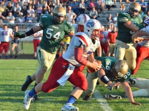 Whitko's Ethan Nicodemus takes it outside on the Warrior defense. 