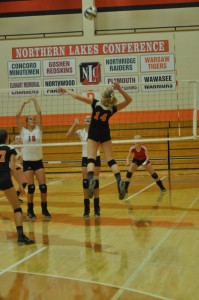 Katie Voelz goes up for a kill attempt for Warsaw Thursday night. The junior had 11 kills as the Tigers beat Goshen 3-0 (Photos by Amanda Farrell)