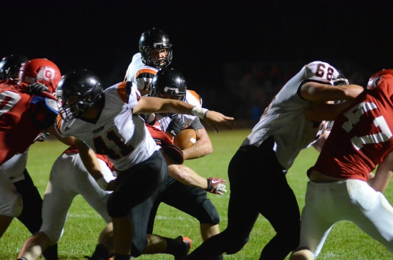 Fullback Jason Taylor leads the way for Tristan McClone Friday night. McClone had three touchdowns and Taylor one in a 34-13 Warsaw win over Goshen.