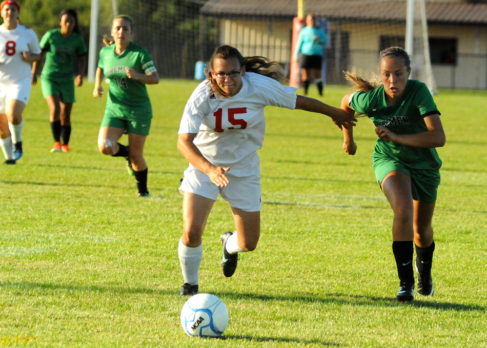 Whitko's Christina Baughman (15) battles with Bremen's Jasmine Schafer.