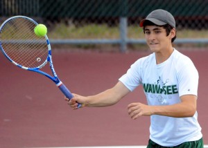 Wawasee's Dylan Houser rallies at the net during the one doubles match.