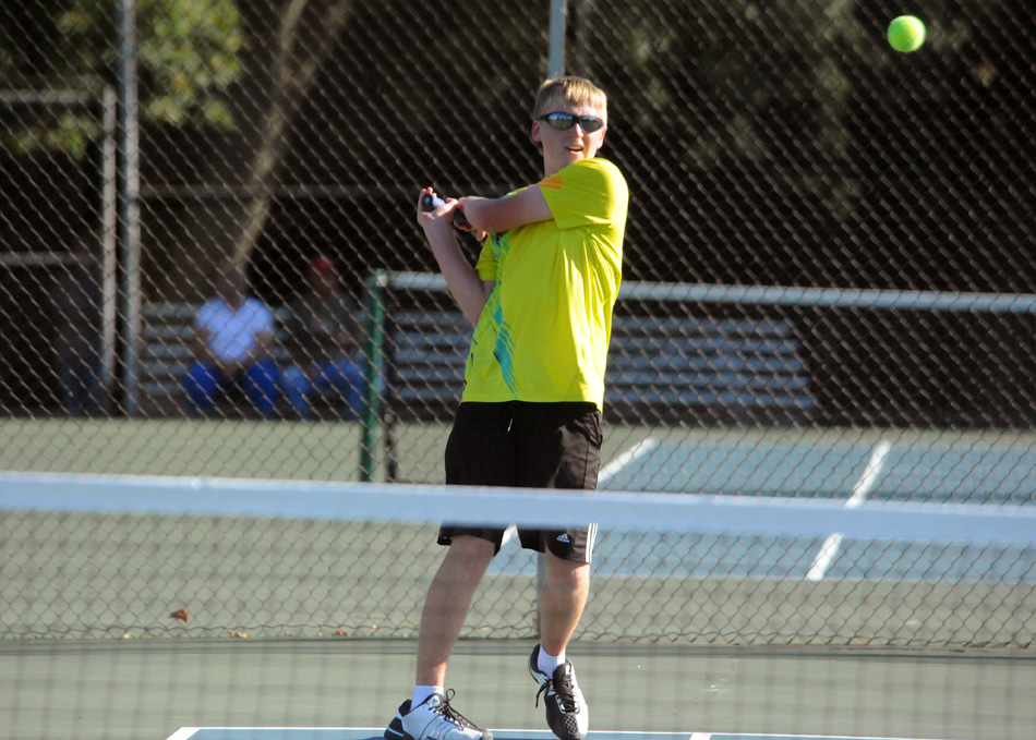 Caleb Ray of Warsaw's two doubles team rips a shot during Ray and partner Nic Jansen's win over Concord at the NLC boys tennis tournament. (Photos by Mike Deak)