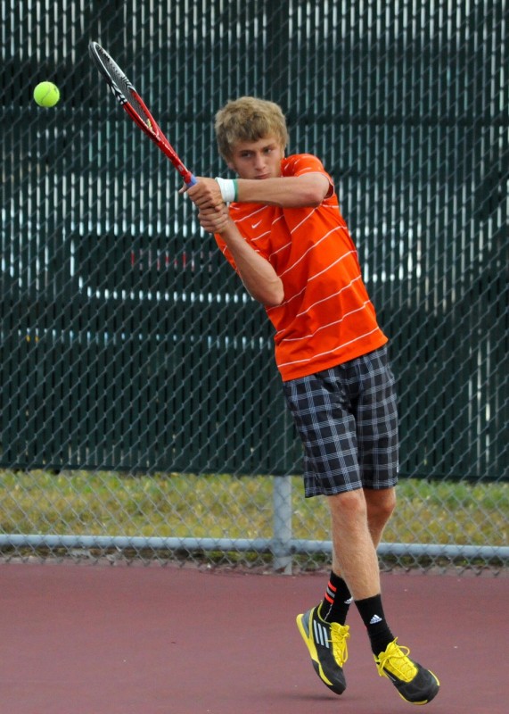 Sam Rice of Warsaw hits a return earlier this week versus Wawasee. Rice won in straight sets at No. 1 singles Thursday night as the Tigers topped NorthWood 5-0 to remain undefeated in conference play (File photo by Mike Deak)