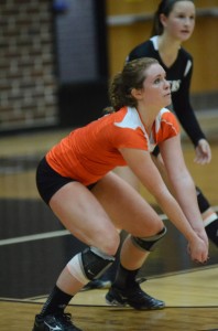 Warsaw's Emily Poe prepares for a serve reception Monday night versus Penn.