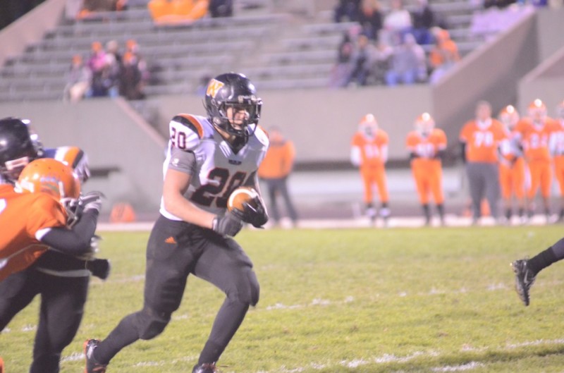 Warsaw star tailback Tristan McClone heads for one of his four first-half touchdowns Friday night during a 40-20 playoff win at Fort Wayne Northrop (Photos by Scott Davidson)