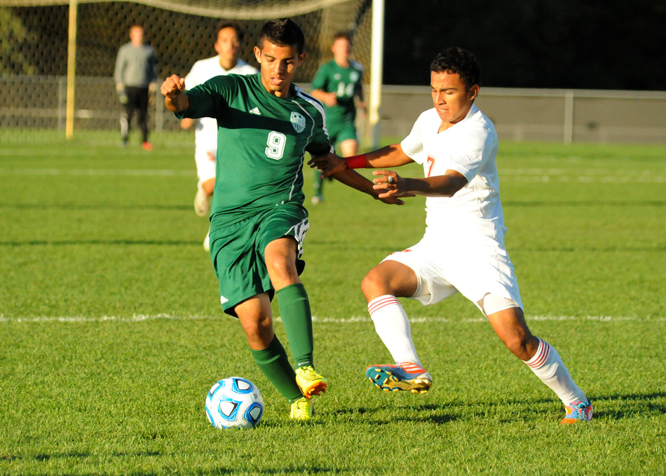 Wawasee's Fernando Camargo dribbles past Plymouth's Antonio Calderon during the first game of the Warsaw Boys Soccer Sectional Monday night. Plymouth won 3-1. (Photos by Mike Deak)