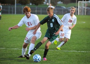 Rasmus Rich of Wawasee is closed in by Plymouth's Kyle Barry.