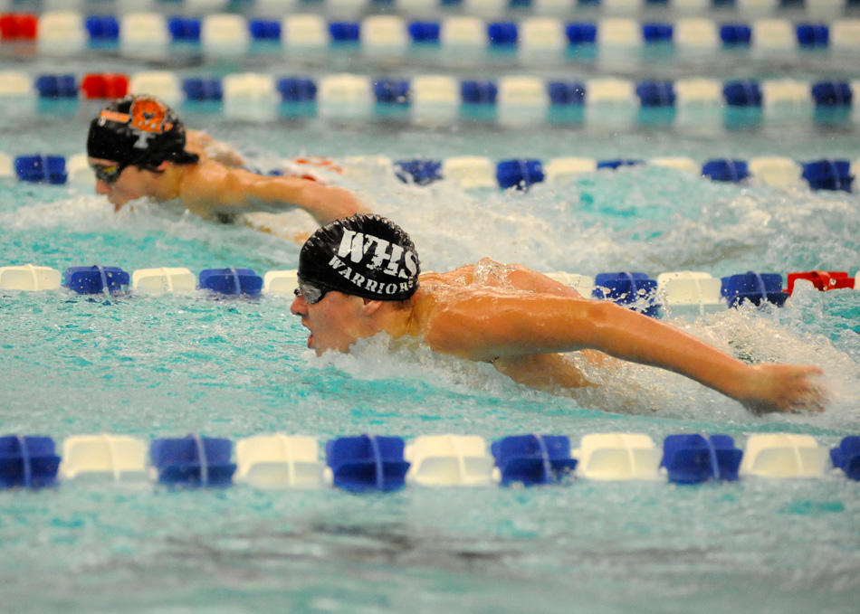 Wawasee's Logan Brugh, foreground, and Warsaw's Zach Taylor swim side by side in the butterfly Saturday morning. Taylor would catch Brugh on the final 25 yards to win by .60 seconds. (Photos by Mike Deak)