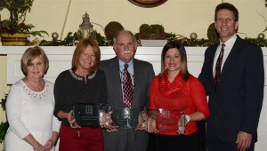 From left are Joyce Needler, 2014 KBOR president; Lori Rockwell, 2013 REALTOR® of the Year; Greg Mitchell, 2013 REALTOR® of the Year; Amanda Tom, 2013 Affiliate of the Year, Steve Savage, 2013 KBOR president. (Photo provided)