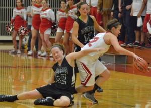 Elizabeth Jackson (10) and Hannah Haines (22) force a turunover on Goshen late in Friday's game.