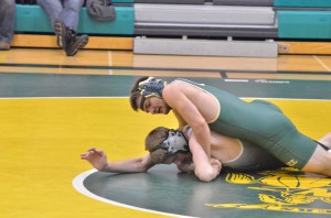 Michael Pena of Wawasee manhandles Northridge's Devin Rudloff in the 145-pound match.