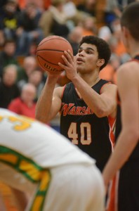 Warsaw's Rashaan Jackson eyes a free throw late in the game Friday night. Jackson was outstanding with 26 points in a 58-56 NLC loss at Northridge.