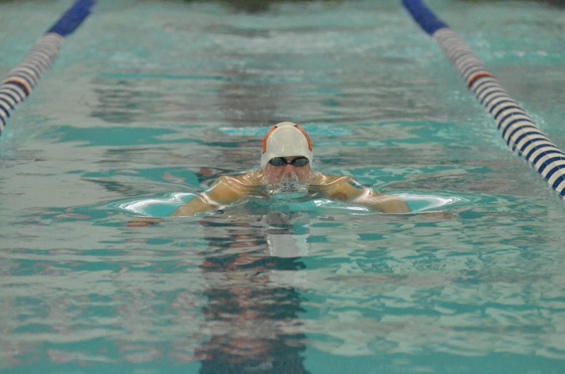 Spencer Davidson breaks the surface for the first time during his prelim swim in the 100 breast.