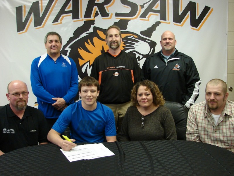 WCHS senior Caleb Heckaman has signed to play baseball at Ancilla College. Shown above in front (from left) are Chad Heckaman, Caleb Heckaman, LeAnn Brand and Nick Brand. In back are Ancilla College baseball coach Joe Yonto, WCHS baseball coach Mike Hepler and WCHS athletic director Dave Anson (Photo provided)