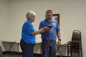 Girl Scout Leader Barb Grumme, Troop No. 00148, presented Chad Jonsson, Syracuse park superintendent, with a community recognition award during the park board’s regular monthly meeting Monday night.