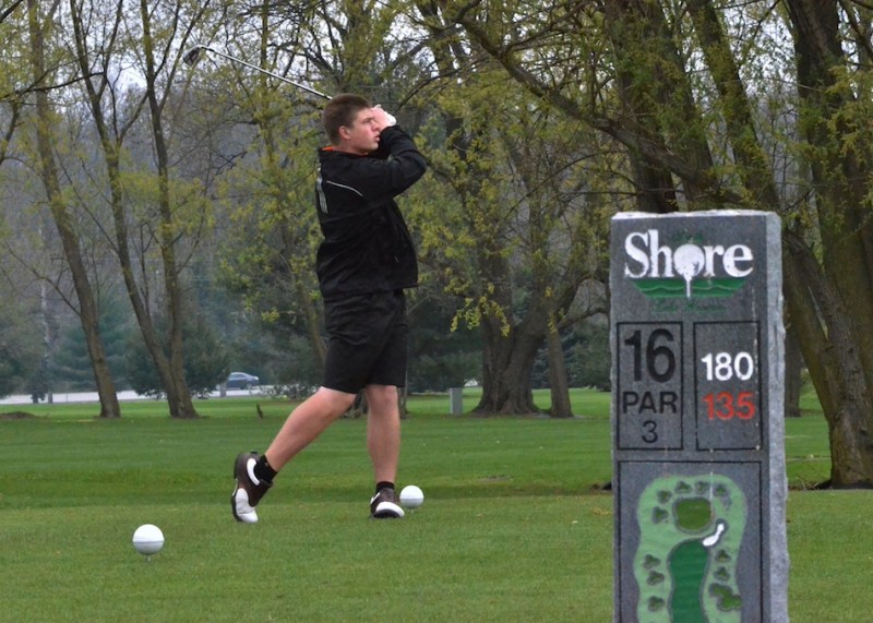 Luke Johnson tees off on No. 16 for Warsaw during the 2014 Wawasee Invitational at South Shore Golf Club. (Photos by Nick Goralczyk)