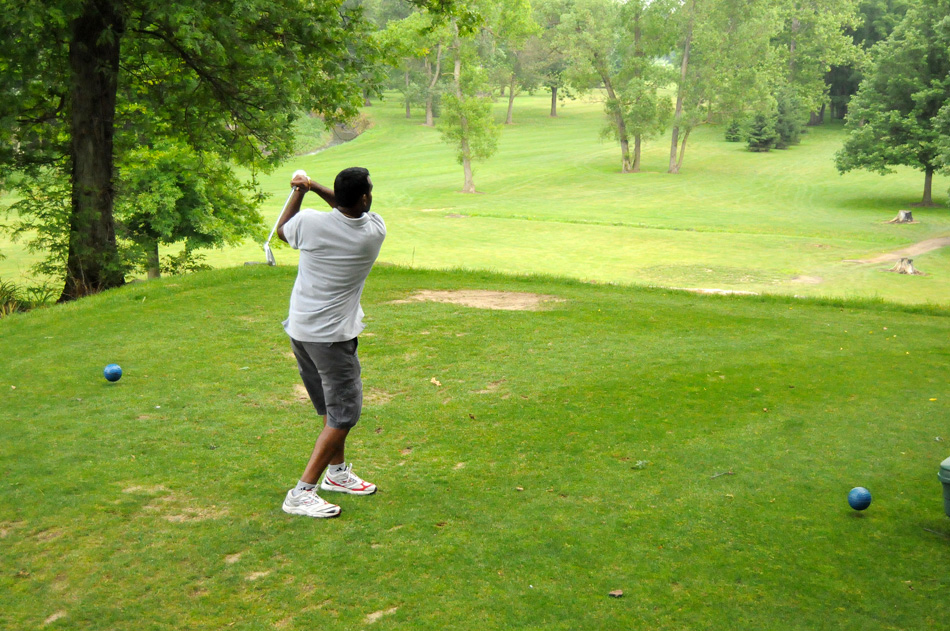 Vinay Tikka tees from the second hole at Little Bighorn Golf Course, which is the only elevated "cliff" shot in the county.