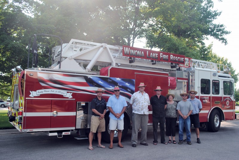 The Village at Winona will be smokin' hot on Saturday with the celebration of the WLFD 100 year anniversary and the CCS Blue Jeans & BBQ Gala. Pictured are Village manager Jeremy Marsh; Community Cowboy Chefs, Mayor Joe Thallemer, Gordy Clemens, John Tucker, Dana Leon Huffer, Matt Metzger and Dane Miller's Guest Chef, Mitch Titus. chief of Winona Lake Fire Department. 