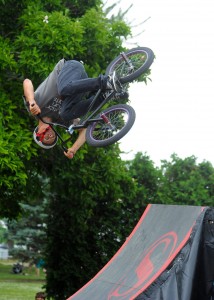 Solution Action Sports rider Jordan Stark performs a trick during the BMX demo at the Tour des Lakes base at the Syracuse Community Center.