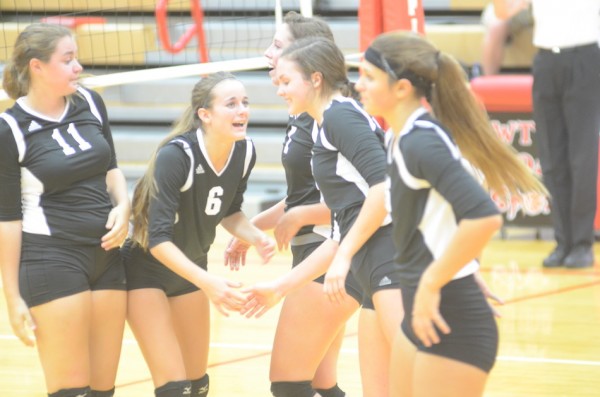 Cassie Hoag celebrates with her teammates.