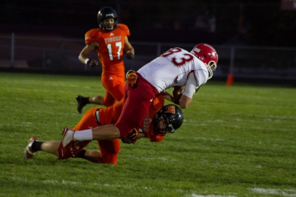 Warsaw's Dylan Childers tackles Goshen tight end Adam Pearson.