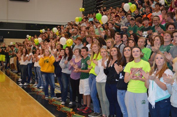 Senior and junior Wawasee High School students look up as the band plays the school fight son during the pep rally Friday.