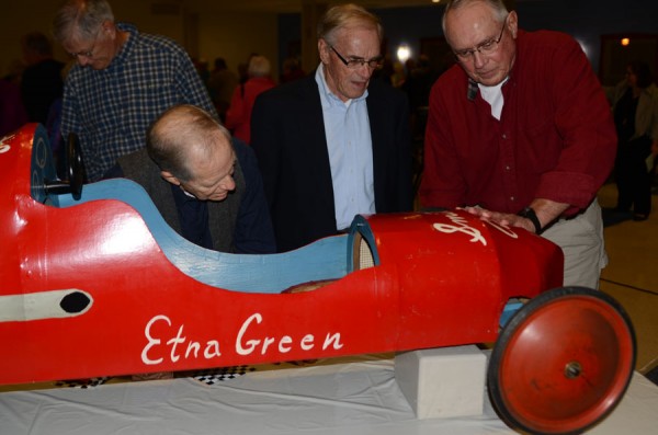 Harry Gigous and Bill Huffer talk with Larry Shively on the design of his soapbox derby car he raced in 1955 and 1956. (Photo by Deb Patterson)