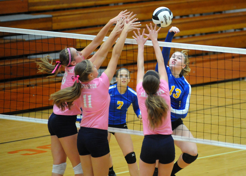 Triton's Lauren Hostrawser hits around three South Central defenders during Triton's 3-1 win Saturday in the Culver Volleyball Sectional semi-finals. (Photos by Mike Deak)