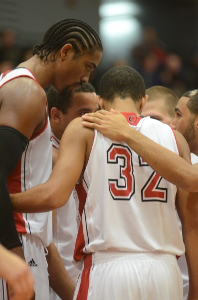 The Lancers huddle together during their win Friday night in the season opener.