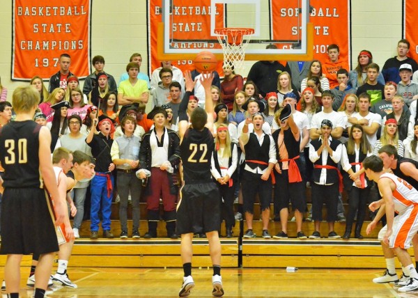 Justin Bachelder tries to avoid scurvy while shooting towards the Warsaw students sectiona on pirate night.