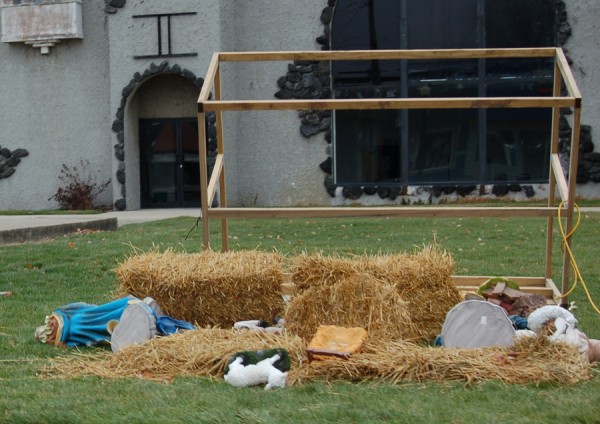 This is what remains of The Nativity Scene looked like Monday afternoon after a gust of strong winds damaged the display. The figures have been left flat to avoid further damage until the wind lets up. (Photo by Jodi Magallanes)