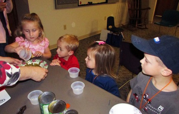 Jocelyn Keller, Owen Morehouse, Lylah Young, and Westen Haab work together to make Stone Soup at Fall Story Time on Nov. 5.