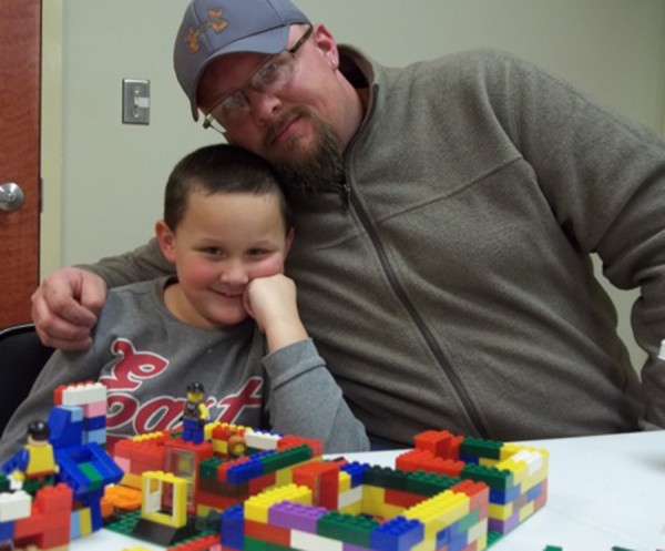 : Mason and Nick Beckman enjoy some father and son time at the library’s LEGO Club.