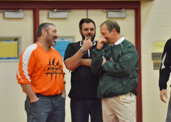 Warsaw assistant coach Dan Hatch (left), Warsaw head coach Justin Smith (center) and Wawasee head coach Paul Meyer (right) share some laughs at last weekend's NLC Championships.