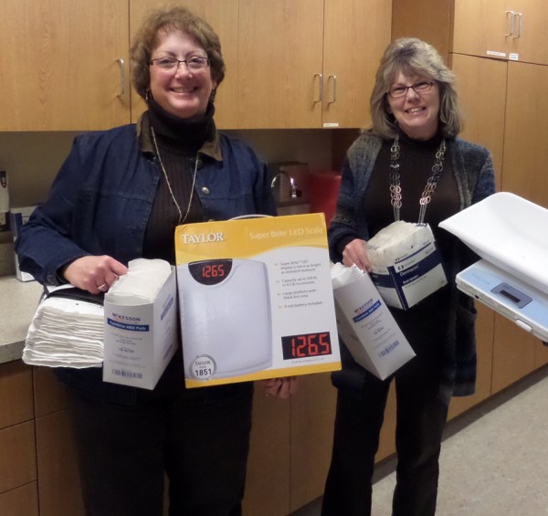 Kathy MacDonald, Home Care Nurse & Claire Elliott, Director of Home Care  holding medical supplies. 