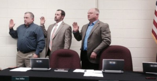 Bryan Murphy, Stan Miller and Todd Hoffman take the oath of office. (Photo by Jarrett Van Meter)