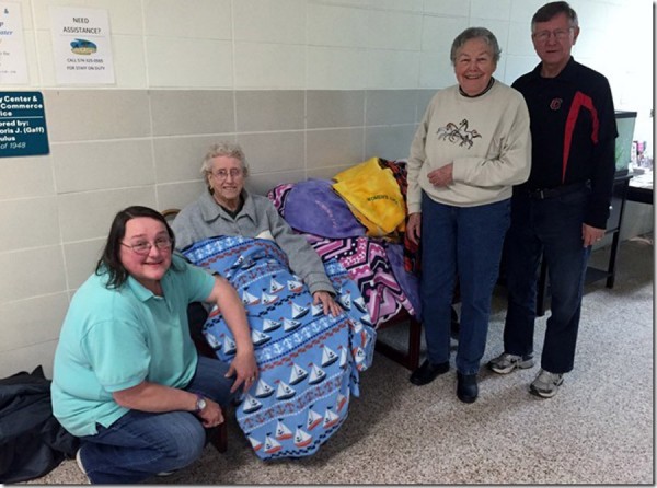 Mary Kiser, Edna Lawson, Tibie Packer from Women's Life are shown with blankets they donated to Ted Mahnensmith representing Covered With Love. (Photo provided)