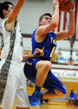 Triton's Jordan Anderson drives for a bucket against Jimtown.