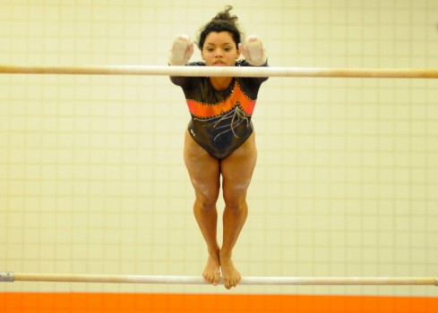 Warsaw's Jazzmine Brown competes on bars Tuesday night against Homestead. (Photos by Mike Deak)