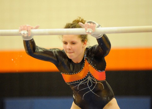 Nadiya Burritt of Warsaw works through her bars routine.